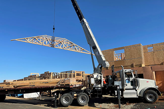 Roof truss being transported by truck